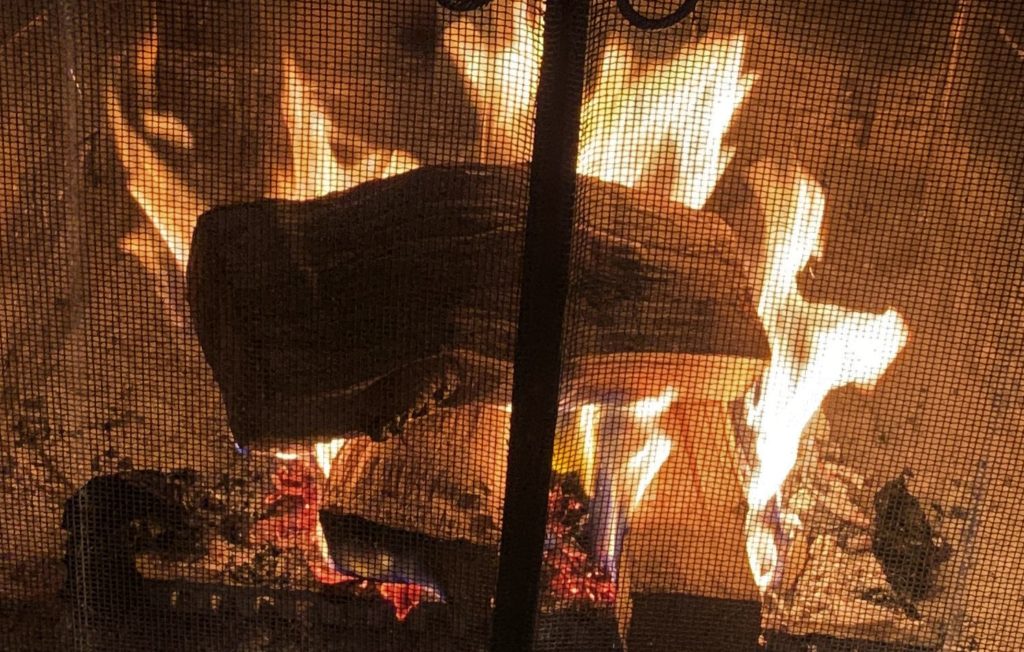 fireplace with burning logs