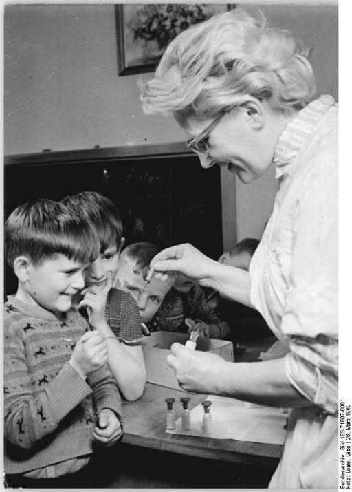 Happy kids getting vaccines in 1950