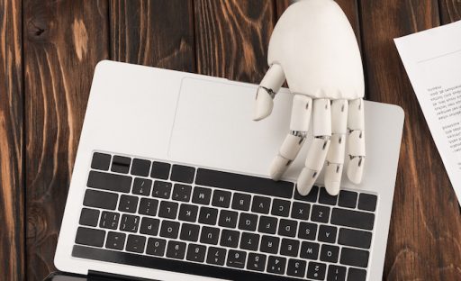 The power of machine learning_laptop and AI hand