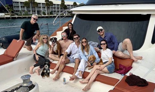 happy people and dogs on a boat